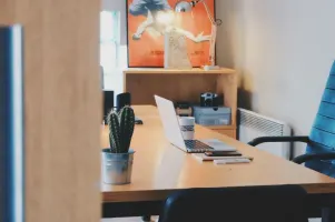 Photo of desk in sunny office
