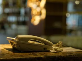 Photo of phone on a surface next to a window