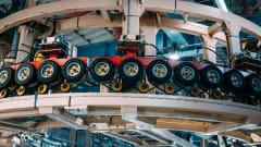 Tires hung up on wall in factory.