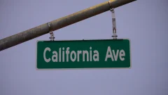 Green road sign that says California Ave
