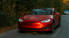 Front of red tesla car.