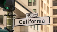 White road sign that says California and points to highway 400.