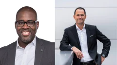 split picture. on the left is a black man wearing a suit and glasses. on the right is a white man wearing a suit.