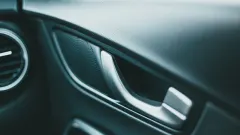 Door handle in interior of new-looking vehicle