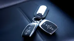 Two Mercedes key fobs on a key chain