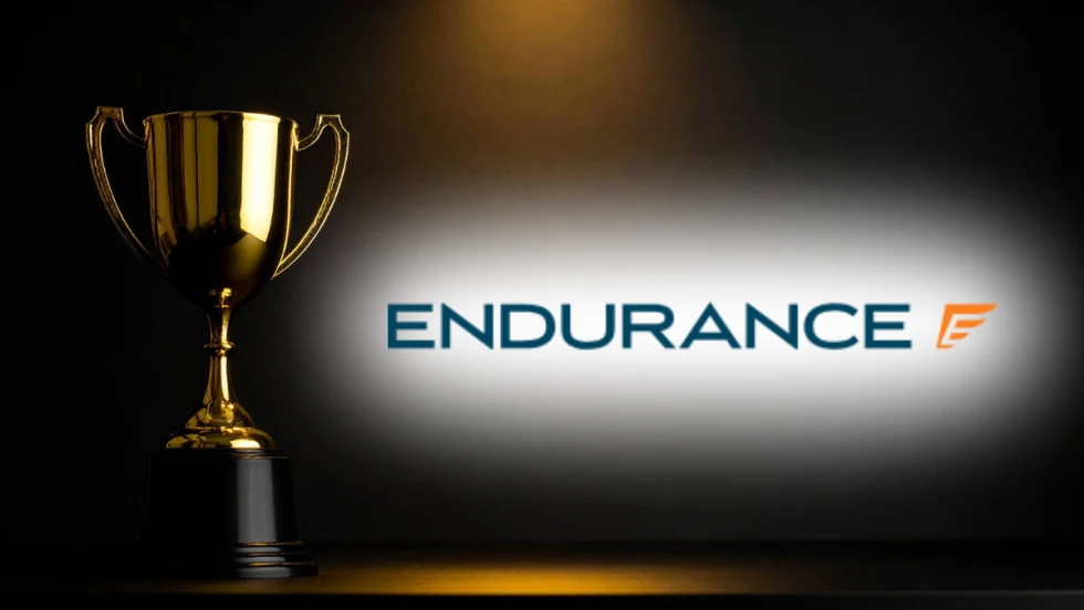 A gold trophy next to the Endurance logo on a dark background.