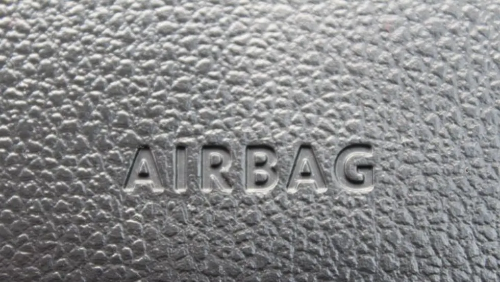 Closeup photo of 'airbag' stamp on a car dash