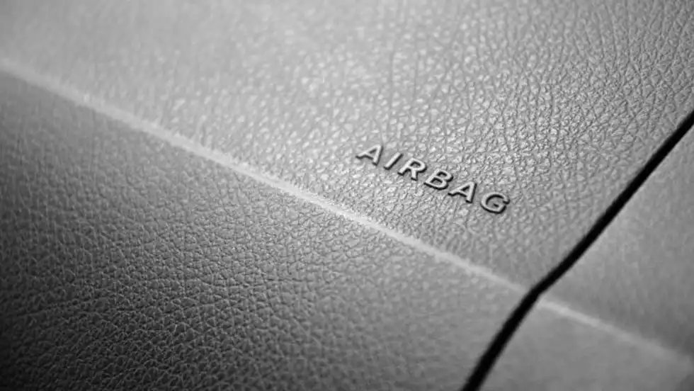 Photo of "airbag" term on car dashboard