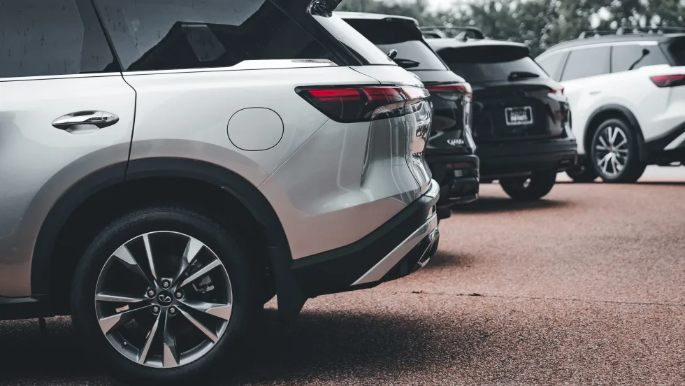 Photo of multiple new SUVs on a car dealership lot