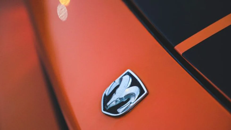 Dodge emblem on orange vehicle