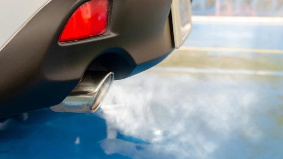 Car exhaust pipe blowing exhaust.