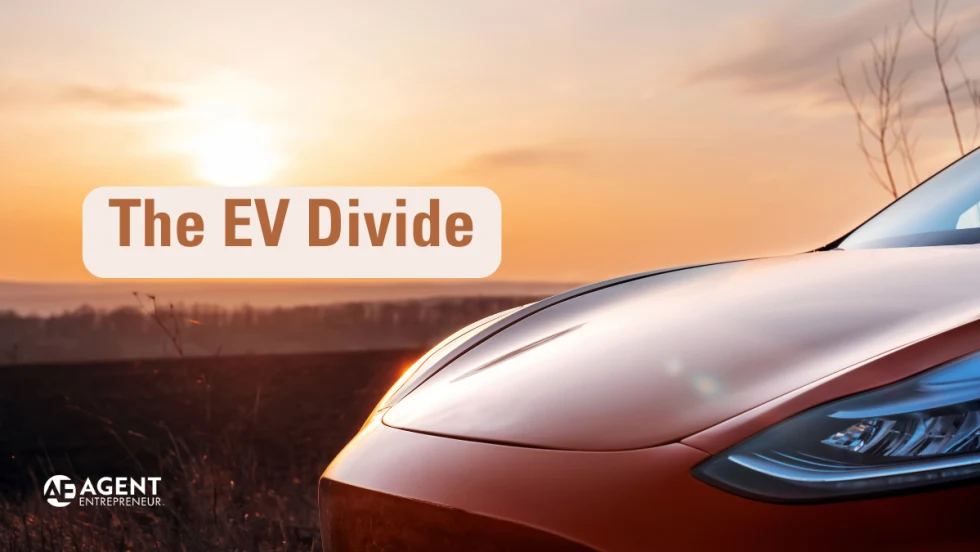 Hood of orange Tesla in front of sunrise