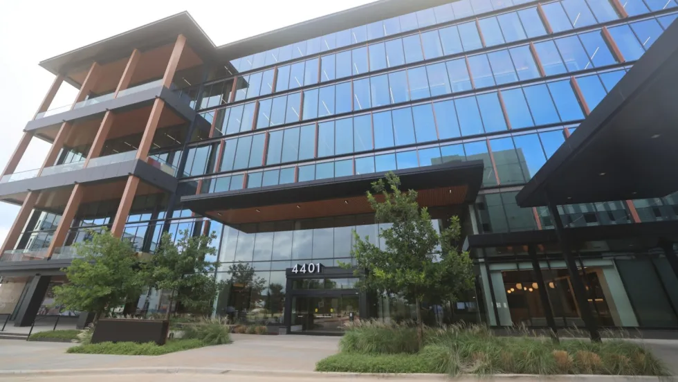 Front of large glass-paned, multistory office building