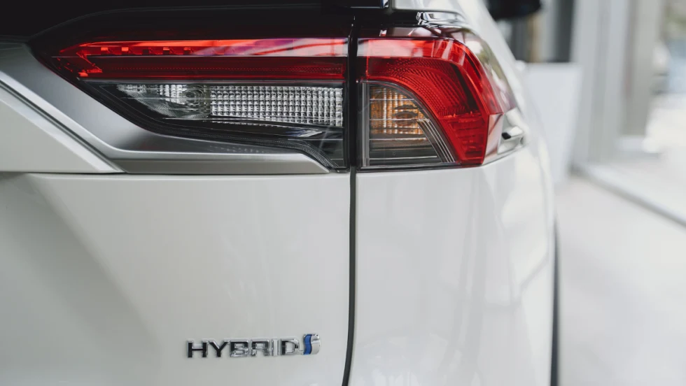 Twilight of white hybrid car.