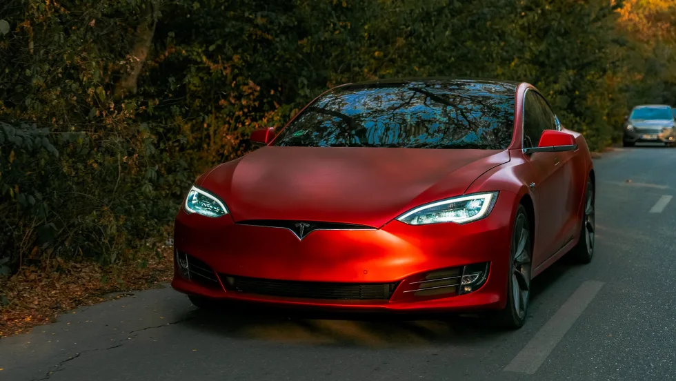 Front of red tesla car.