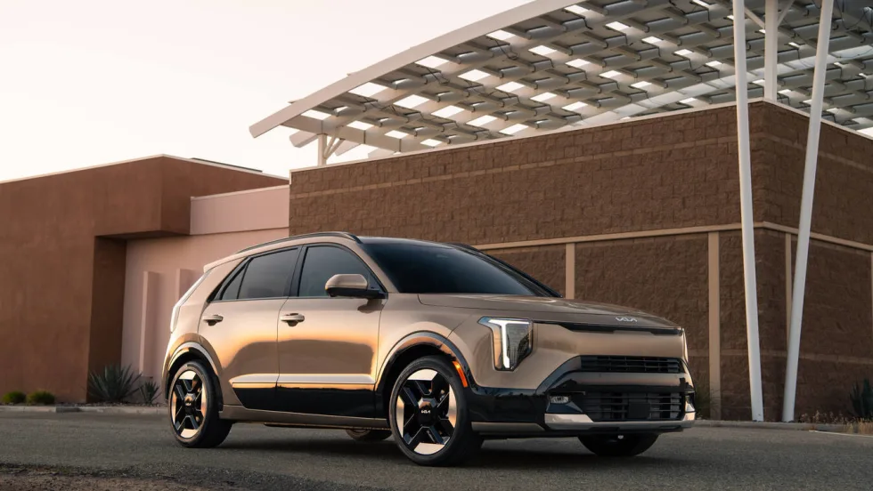 Kia Niro SUV in gold color parked outdoors