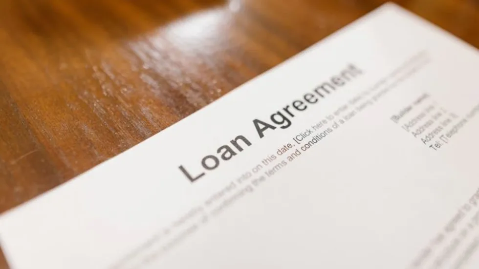 Photo of a loan contract on a desk