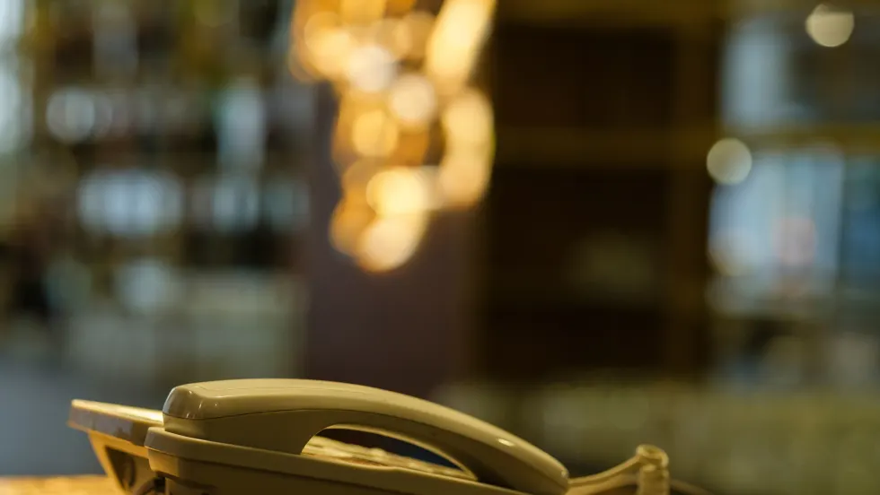 Photo of phone on a surface next to a window