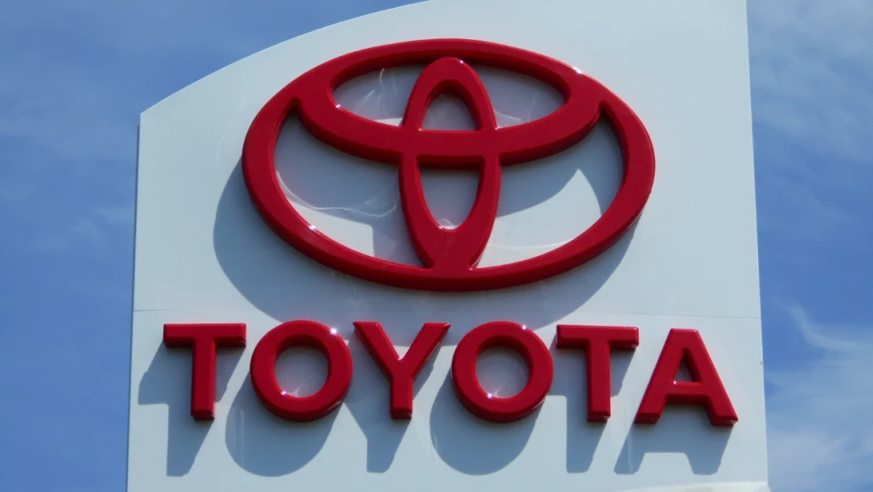 red Toyota name and logo on white building