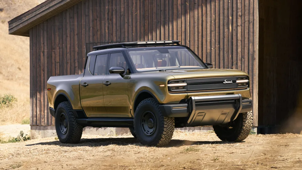 Photo of Scout Terra pickup truck outside farm building