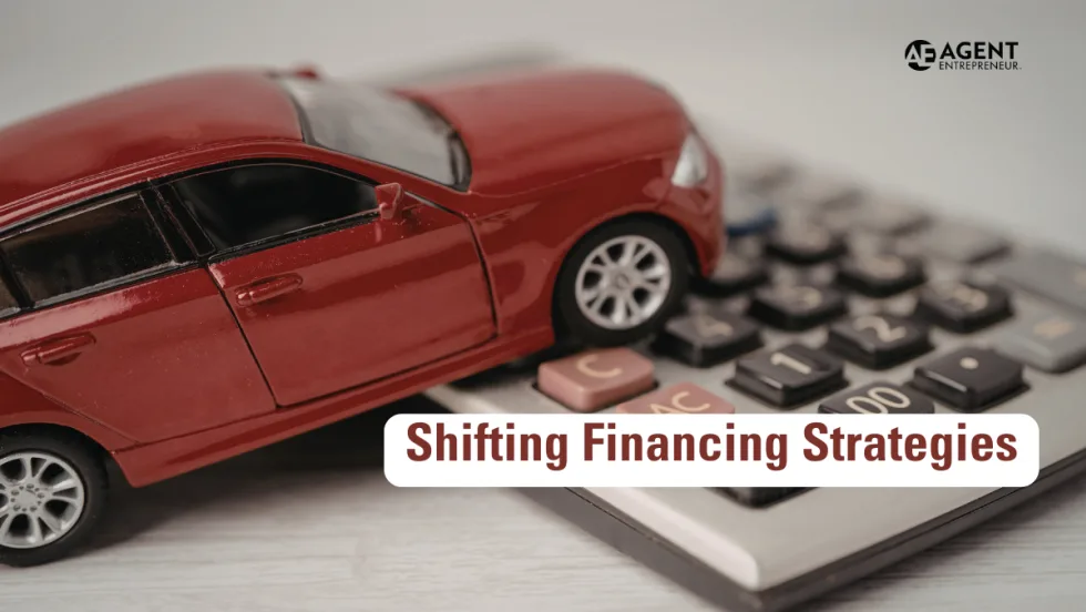 red toy car resting on top of a calculator. Agent Entrepreneur logo. Shifting Financing Strategies