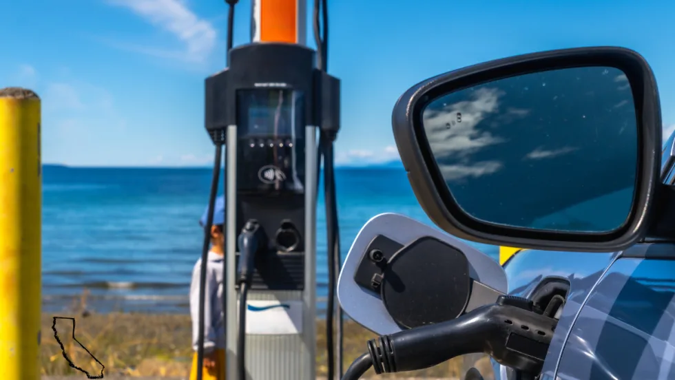 electric vehicle charging in front of ocean view