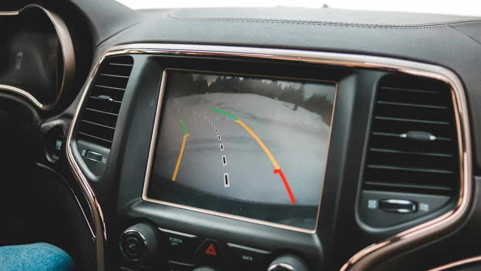 interior car dashboard, infotainment system, showing rearview backup camera