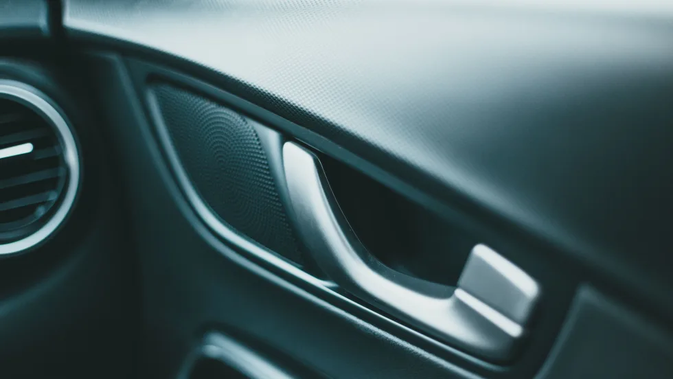 Door handle in interior of new-looking vehicle