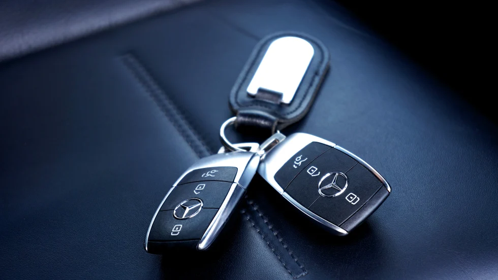 Two Mercedes key fobs on a key chain