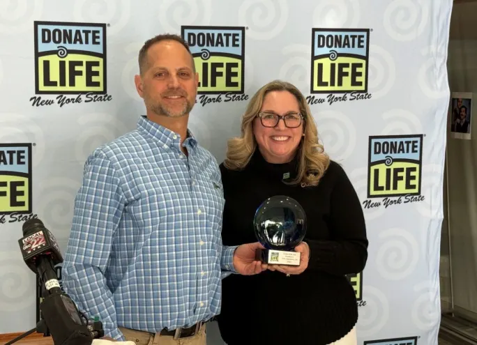 Jason Ellis and Aisha Tator with the Dealer of the Year award
