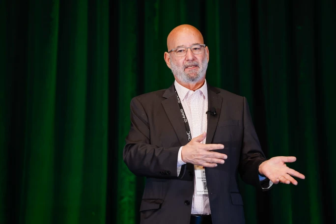 Peter Chafetz speaking on stage at Agent Summit conference