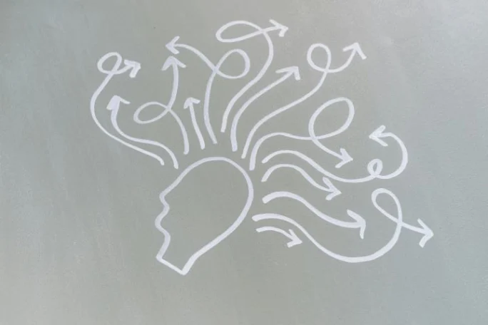 Drawing of a human head with various drawn arrows pointing outward from it