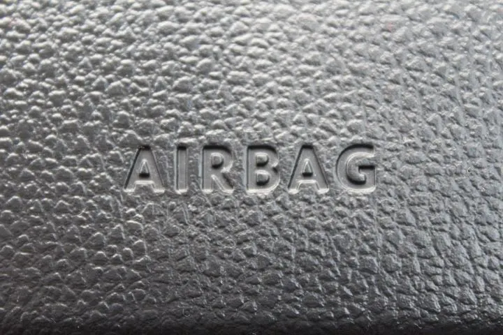 Closeup photo of 'airbag' stamp on a car dash