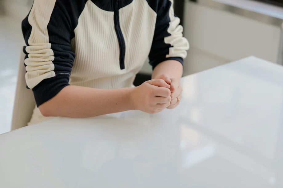 Woman in casual clothing sitting at a desk