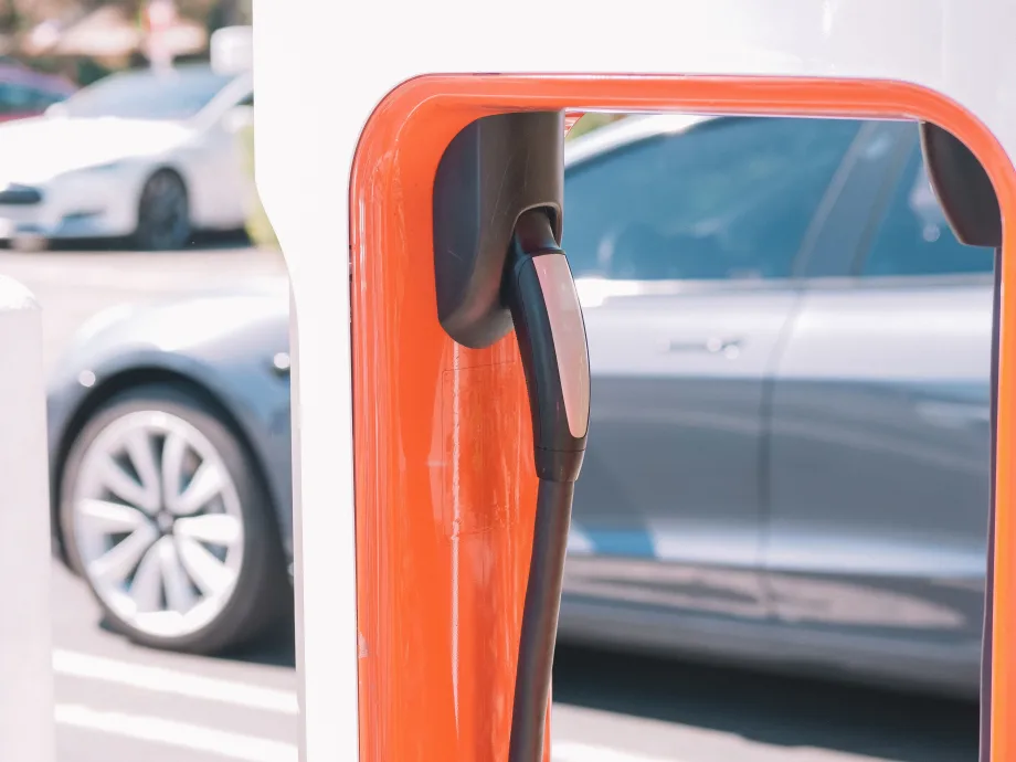Orange electric vehicle charging station.
