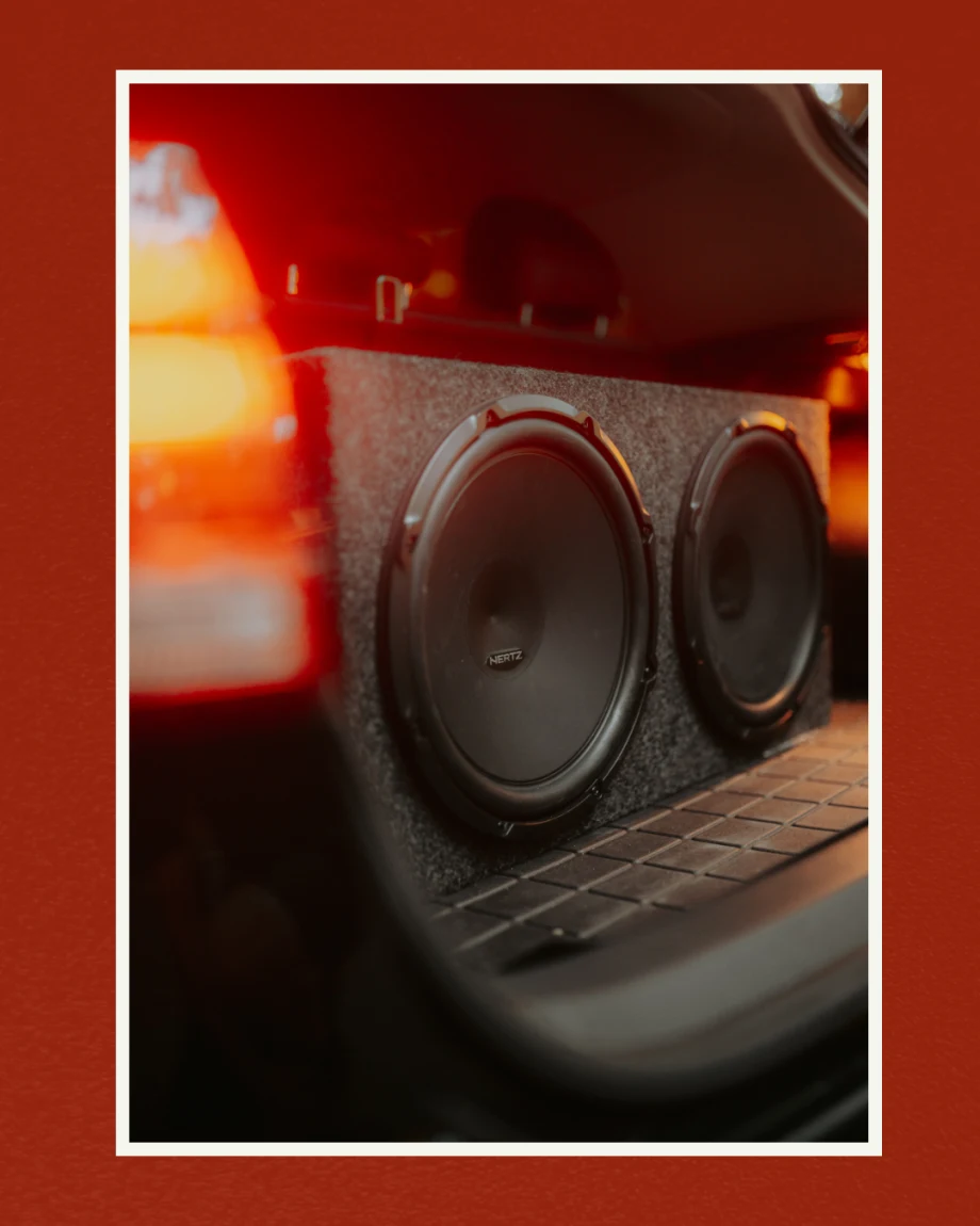 Subwoofer in trunk of car.