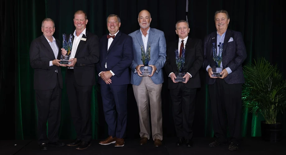 Group photo of men holding awards.