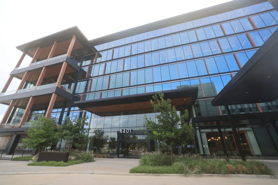 Front of large glass-paned, multistory office building