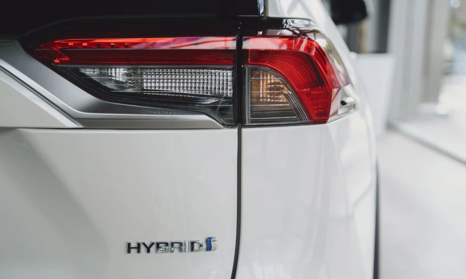 Twilight of white hybrid car.