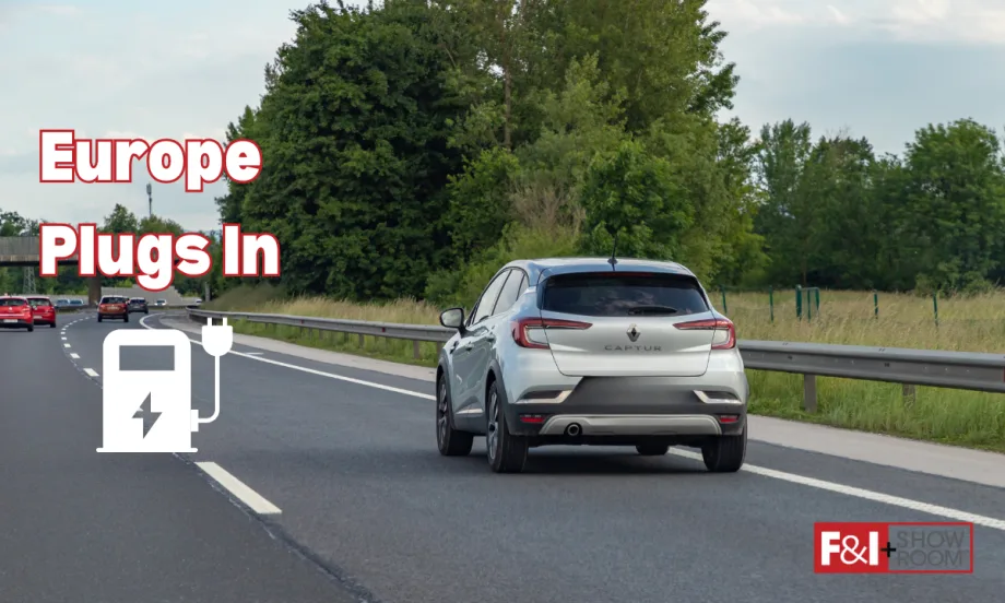 Silver car driving down road with graphic that says “Europe Plugs In”