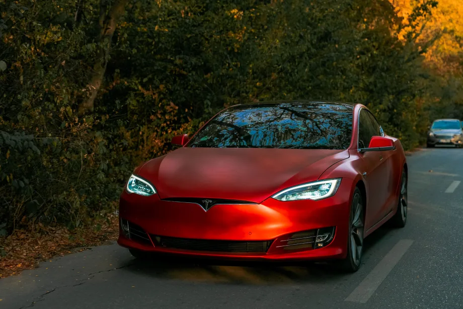 Front of red tesla car.