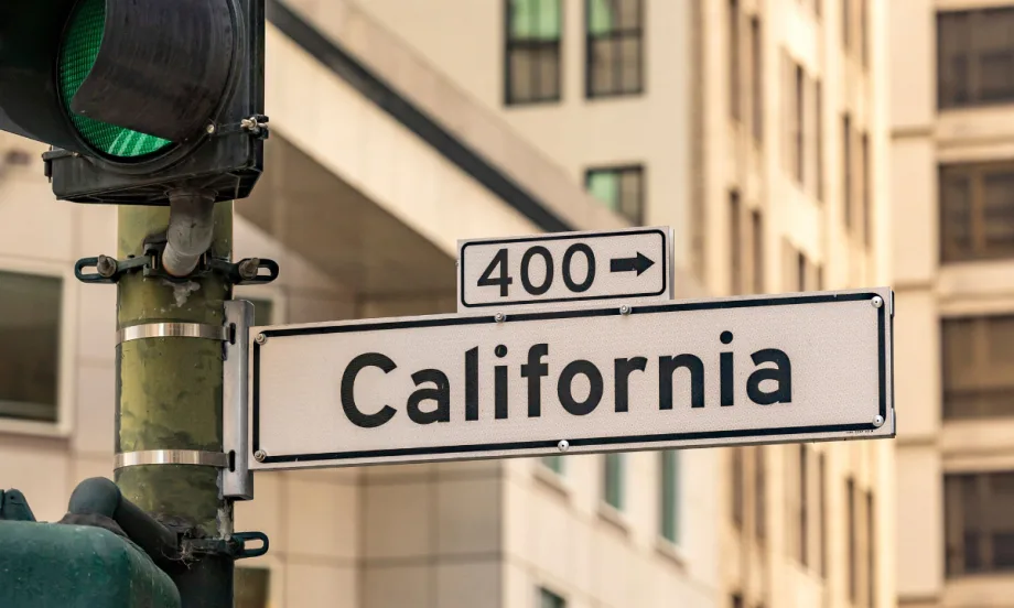 White road sign that says California and points to highway 400.