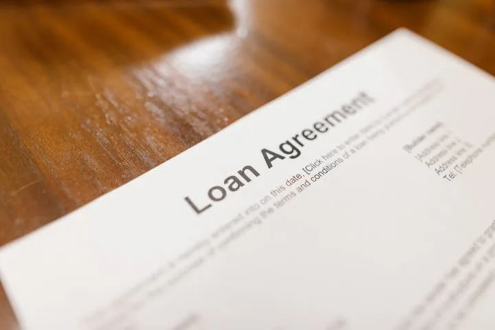 Photo of a loan contract on a desk