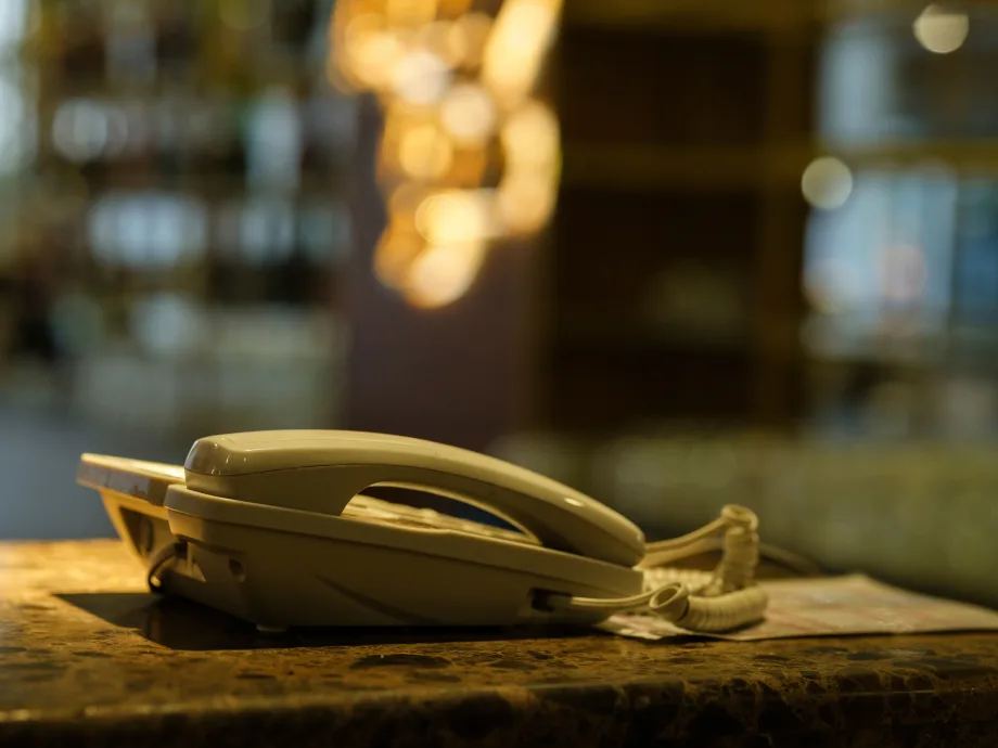 Photo of phone on a surface next to a window