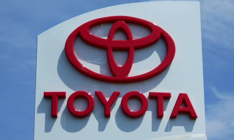 red Toyota name and logo on white building