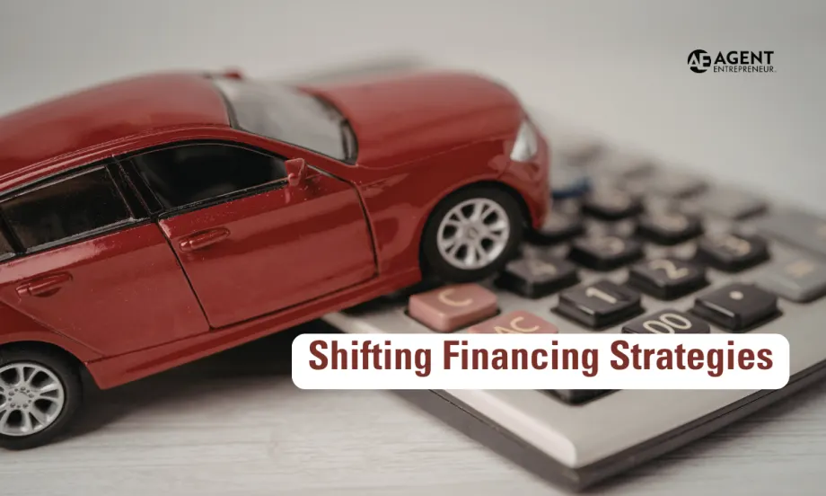red toy car resting on top of a calculator. Agent Entrepreneur logo. Shifting Financing Strategies