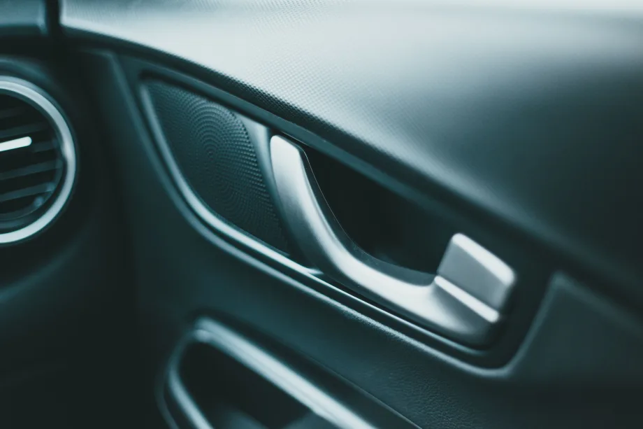 Door handle in interior of new-looking vehicle