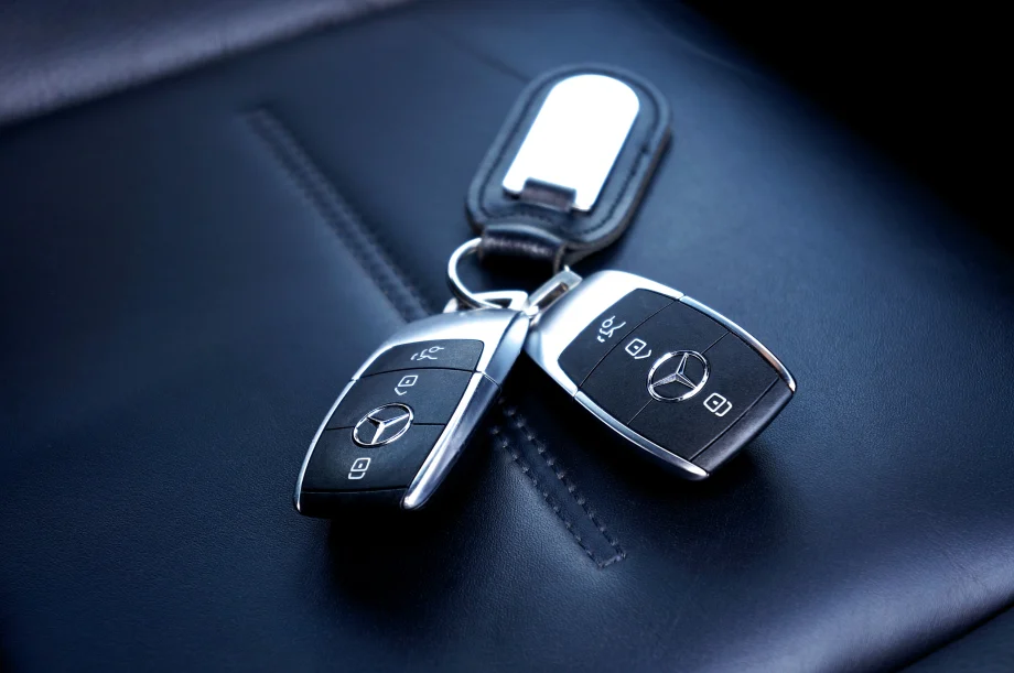 Two Mercedes key fobs on a key chain
